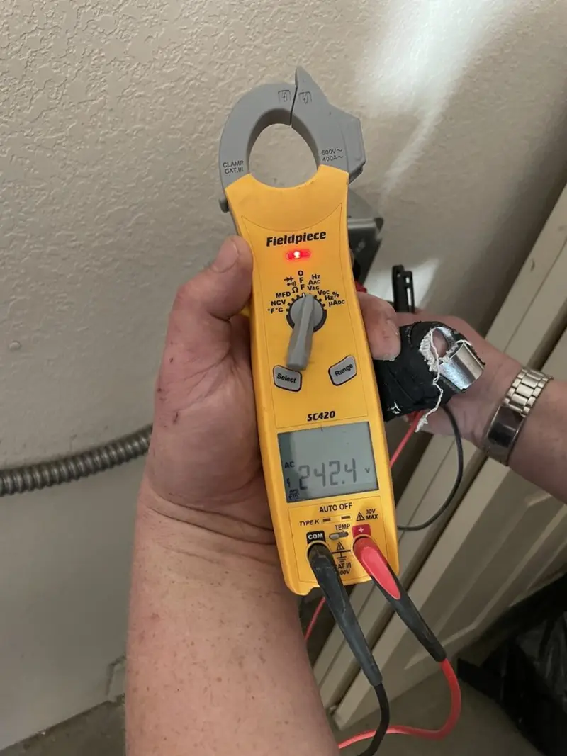 Voltage testing with clamp meter during Whole House Surge Protector in Corsicana